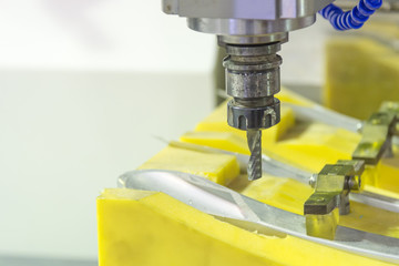 The CNC milling machine cutting the sample jig part with the small end-mill .Hi-precision CNC machining concept.