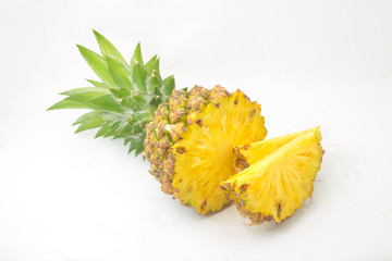 Ripe pineapple with lush green leaves