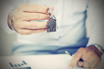 Hand with a house key