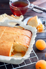 Homemade apricot pie in ceramic form, breakfast, selective focus