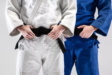 Fotobehang The two judokas fighters posing at studio © master1305