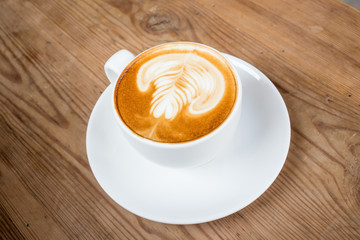 coffe latte cup on a wood table