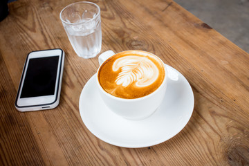 coffee latte with milk froth in cafe