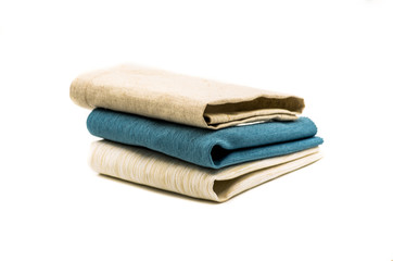 three linen table mats on white