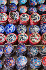 Traditional Cretan painted ceramic dishes for sale at a city centre shop Crete, Greece, Europe.