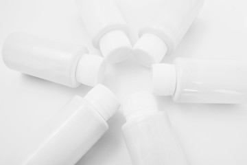 White bottles on a white background