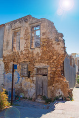 Old wall on medieval streets in Chania city in Crete, Greece