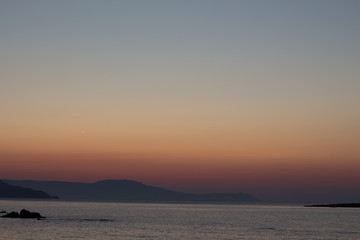 amazing golden sunset at the city of Chania in Crete, Greece. Aegean Sea