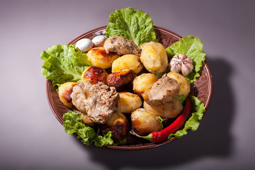 Beautifully decorated dish of potatoes, meat and vegetables