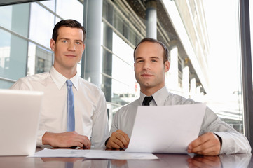 Portrait of two young businessmen
