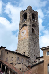 Fototapeta na wymiar BERGAMO, LOMBARDY/ITALY - JUNE 25 : Civic Tower (Campanone - Big Bell) and Palazzo Del Podestaore in Bergamo on June 25, 2017
