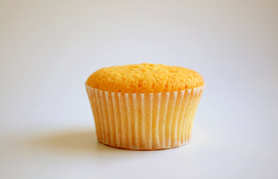 Cupcake baking on white background. Picture for a menu or a confectionery catalog.