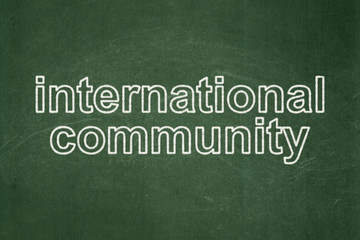 Politics concept: International Community on chalkboard background
