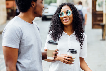 Attractive African American Woman In Sunglasses And Dark Skinned Man Holding Disposable Cups,...