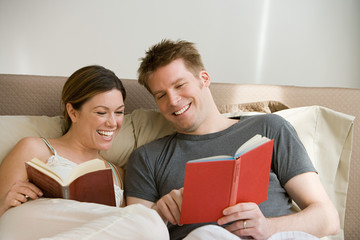 Couple reading in bed