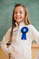 Schoolgirl wearing a rosette