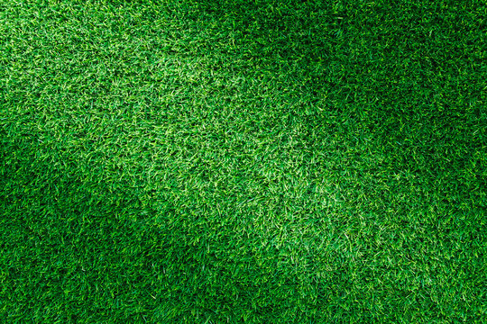 Artificial green grass texture for golf course, soccer field or sports background concept design.
