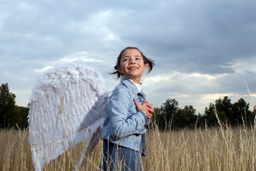 Girl wearing angel wings