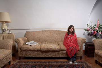 Girl sitting on a sofa