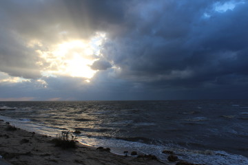The rays of the sun in the clouds by the sea