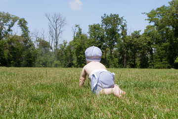 The child is on the grass