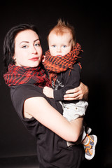 Portrait of a mother and a little boy punks rock
