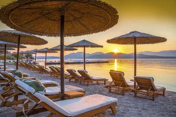 Beautiful sunrise over the beach in Corfu island, in Greece - obrazy, fototapety, plakaty