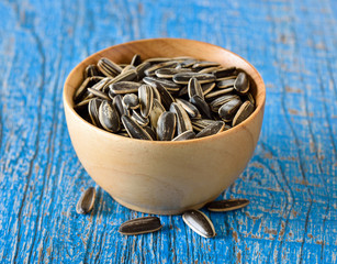 Sunflower seeds in wood bowl