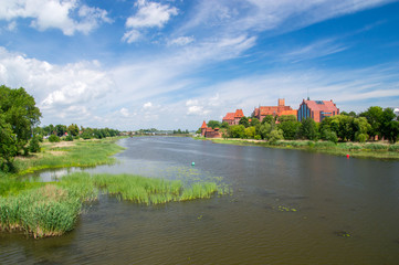 Malbork Castle and the river Nogat in Poland. Castle of the Teutonic Order in Malbork is the largest castle in the world measured by land area.