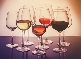 Set of glasses with red, white and rose wine, retro toned