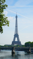 Fototapeta na wymiar View on Eiffel Tower and urban street in Paris, France