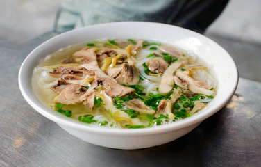 Beef noodle with hot soup in a white bowl