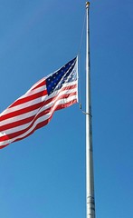 American flag on blue sky background
