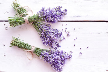 Bunches of fresh purple lavender on white wood