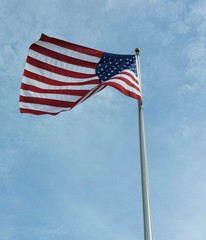 American flag on blue sky background
