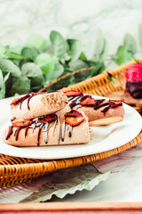 Group of homemade strawberry vanilla popsicles on a rustic wood basket.Summer food and healthy lifestyle concept