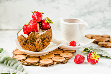Fresh strawberry on coconut cup. Marble background.Selective focus.Healthy diet food concept.Copy space.