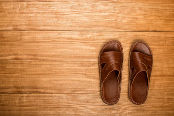 Slippers on a wooden table