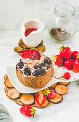 Chocolate ice cream with berries on coconut cup.Summer food and healthy dessert concept.