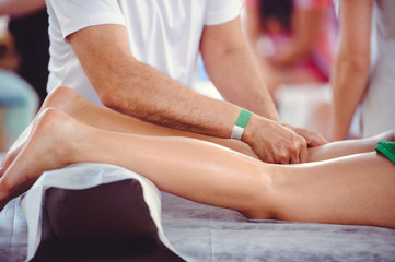Obraz na płótnie Canvas Hands doing foot massage, spa salon
