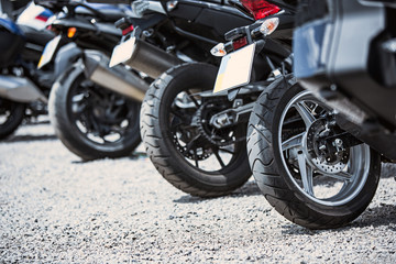 Obraz na płótnie Canvas Motorcycle luxury items close-up: headlights, shock absorber, wheel, wing, toning.
