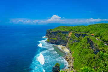 Amazing view of steep cliff and ocean at Uluwatu in Bali, Indonesia