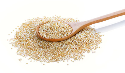Quinoa in a wood spoon on white background