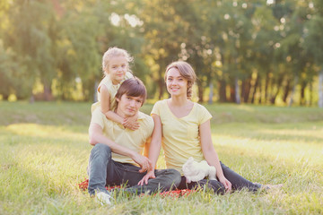 Happy family in the park on a sunny day.