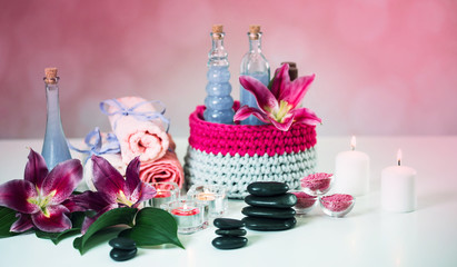 Nature products Spa and wellness setting with flowers, towels, stones and candle