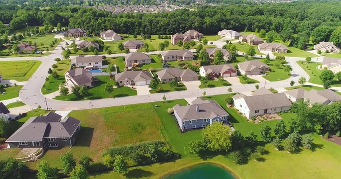 Exceptionally beautiful suburban neighborhoods, mansions, ponds, aerial view.
