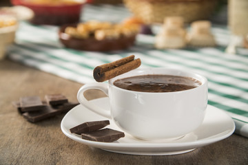 Hot chocolate on the Table with some Brazilian delicious. Festa Junina Theme