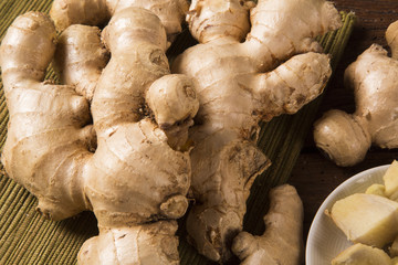 Fresh ginger root on the wooden table