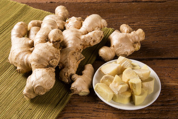 Fresh ginger root on the wooden table