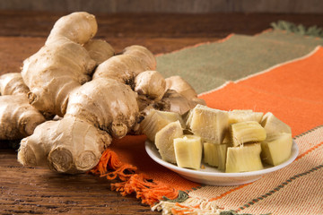 Fresh ginger root on the wooden table